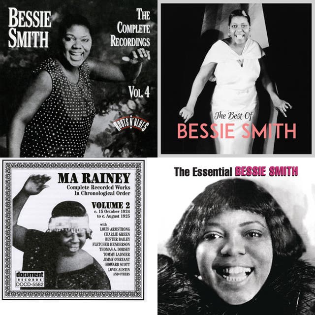 Studio publicity photo of Tampa Red standing with guitar behind seated Georgia Tom.