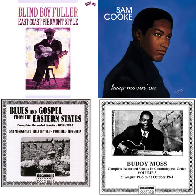 Muddy Waters and Fats Domino standing outdoors together beside a tree.