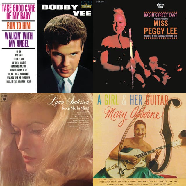 Mary Osborne seated in a studio portrait holding a large electric guitar.