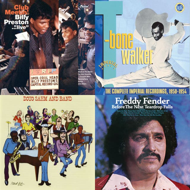 T-Bone Walker doing a split while playing electric guitar behind his head.